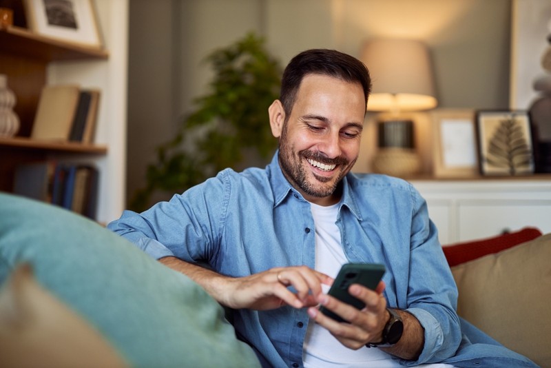 Smiling Man with Phone