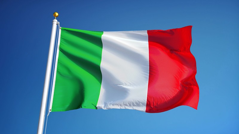 Italian Flag on Pole Against Clear Blue Sky