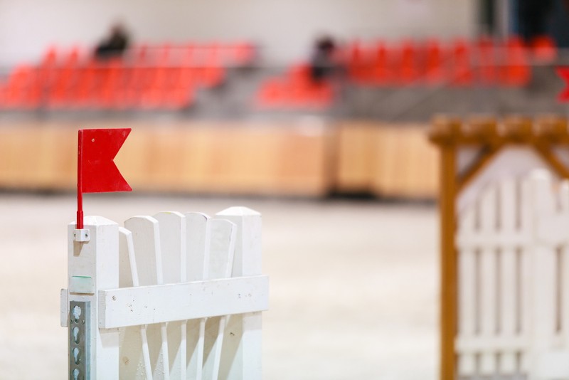 Showjumping Fence Against Blurred Arena