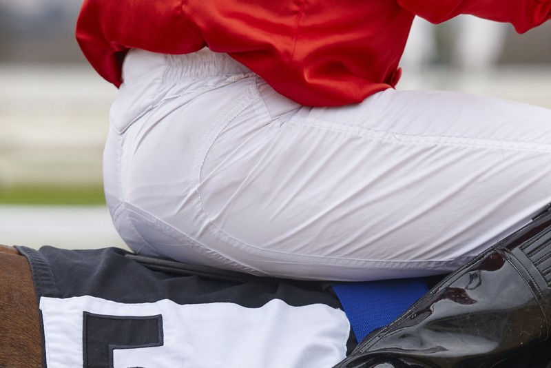 Legs of Jockey Wearing Red Silks